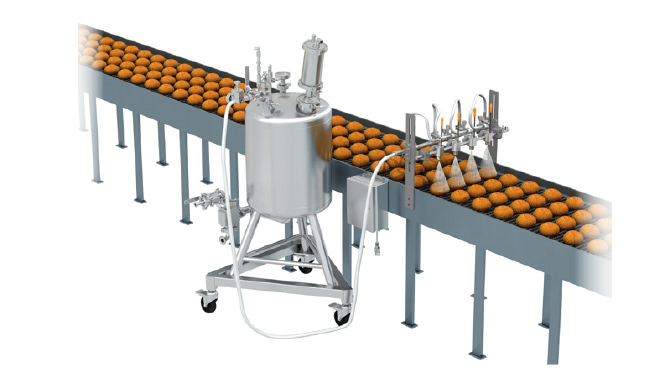 nozzles spraying baked goods on conveyor